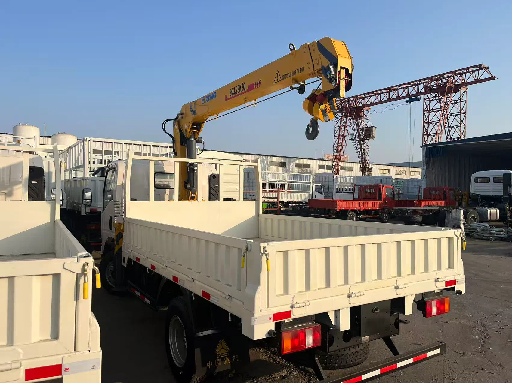 Light-duty truck with on-board crane.webp
